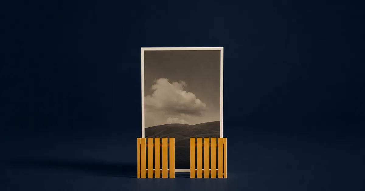 A photograph standing behind a low amber picket fence that has one slat missing